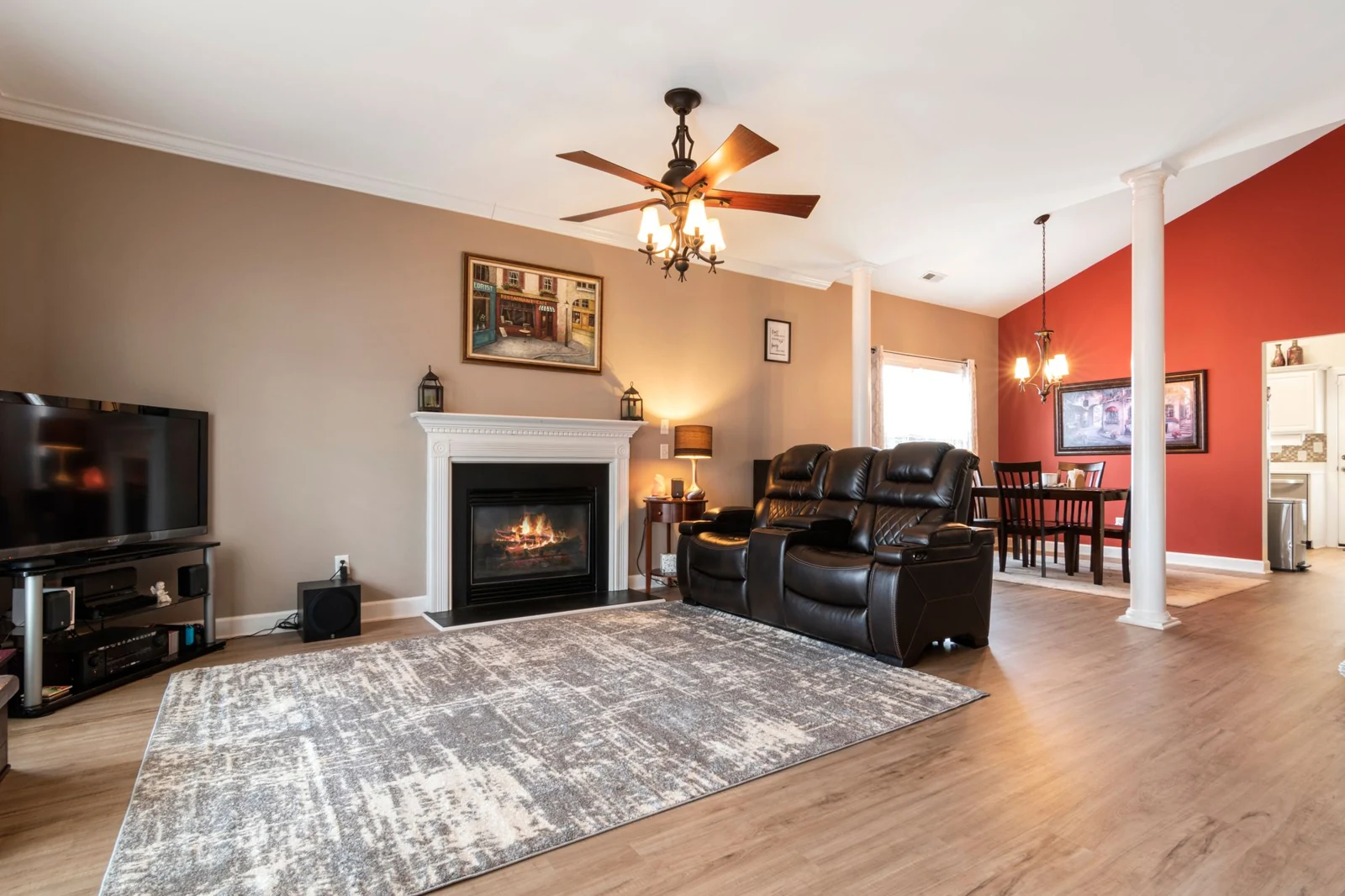 White fireplace surround in a furnished living room